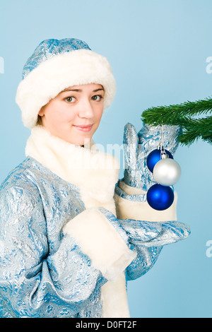 Beautiful girl in costume with new year toys Stock Photo