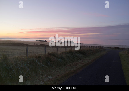 dh  ORPHIR ORKNEY Highland Cottages in mist morning sunrise over Scapa Flow scottish highlands Stock Photo