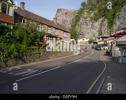dh Valley village uk CHEDDAR GORGE SOMERSET ENGLAND Cyclist riding up hills in cycling road tourist cycle bike Stock Photo