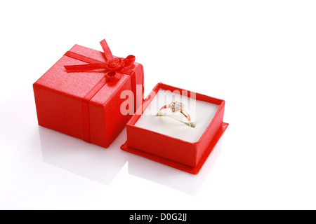 Heart shaped ring in red gift box isolated on white with copyspace