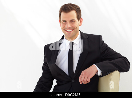 Attractive young professional smiles broadly Stock Photo