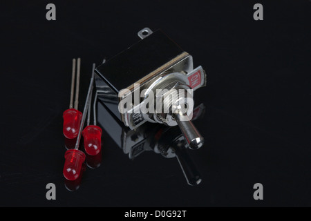 Close up of a switch with on and off labeled Electrical PCB component Stock Photo