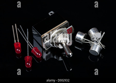 Close up of a switch with on and off labeled with LEDs and transistors Electrical PCB component Stock Photo