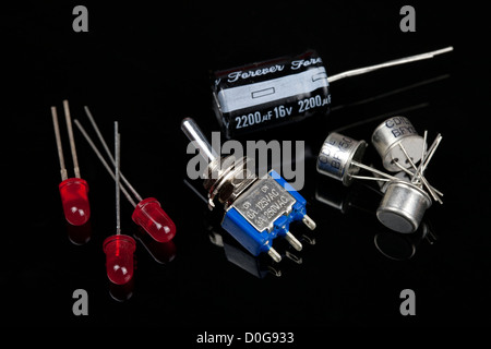 Close up of a switch LEDs and capacitors  Electrical PCB component Stock Photo