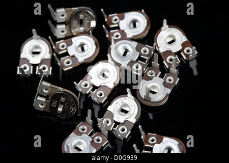 Close of potentiometers on a black background Electrical PCB component Stock Photo