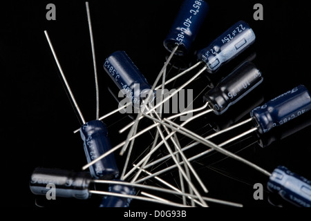 Close up of capacitors on a black background Electrical PCB component Stock Photo