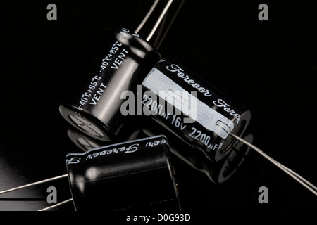Close up of capacitors on a black background Electrical PCB component Stock Photo