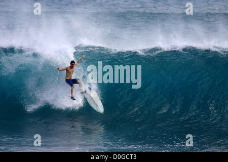 Surfer wipeout while surfing at Padang Padang on the Bukit Peninsula of Bali Stock Photo