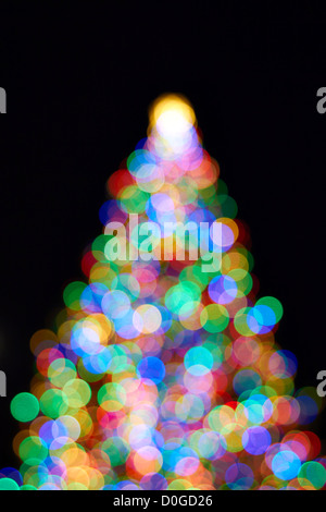 Christmas Tree with Colorful Out of Focus Blurred Light on Black Background Stock Photo