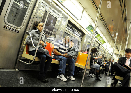 Subway commuters on the “D” line, Manhattan, New York City, USA Stock Photo