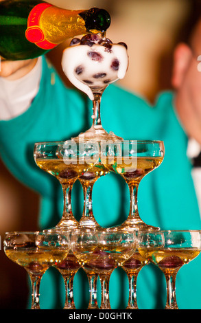 Champagne poured onto a champagne waterfall on a cruise ship Stock Photo