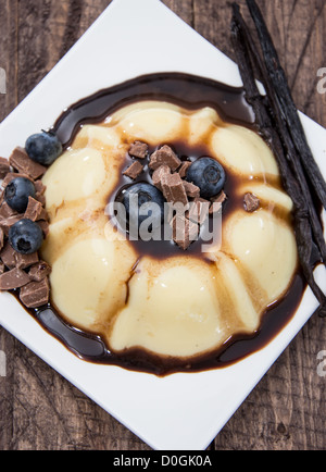 Portion of Vanilla Pudding with chocolate sauce  Stock Photo