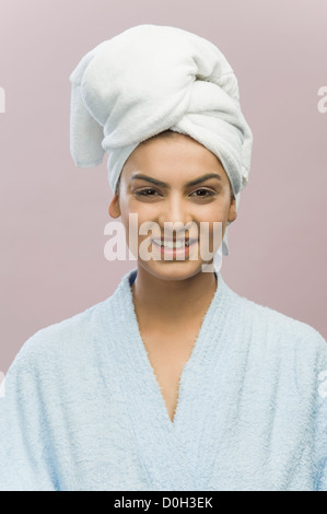 Portrait of a young woman with her head wrapped in a towel Stock Photo