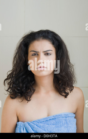 Portrait of a young woman wrapped in a towel Stock Photo