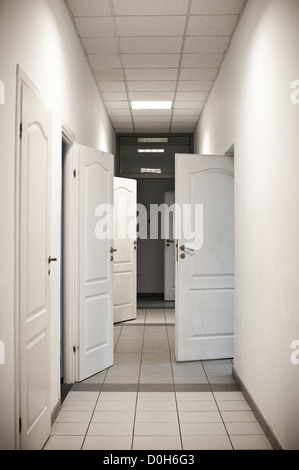 corridor with many doors open - black and white Stock Photo