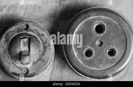Close-up of an old lightswitch and a socket Stock Photo