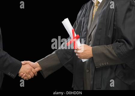 Close-up of two businessmen shaking hands Stock Photo