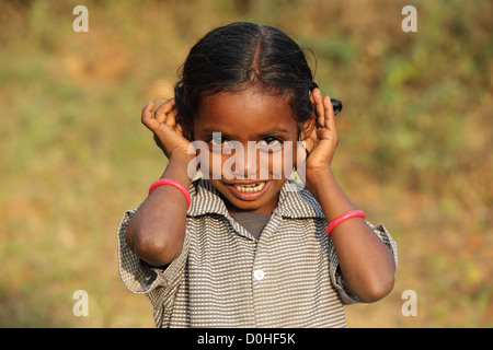 Indian girl cupping her ear to improve hearing Andhra Pradesh South India Stock Photo