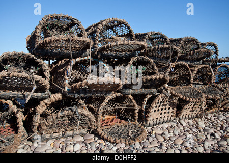 Budleigh Salterton, UK: Lobster pots on the shore line of Budleigh Salterton beach, UK. Stock Photo