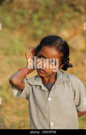 Indian girl cupping her ear to improve hearing Andhra Pradesh South India Stock Photo