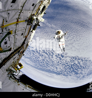 Backdropped against the blue and white Earth 130 nautical miles below, astronaut Mark C. Lee tests the new Simplified Aid for EV Stock Photo