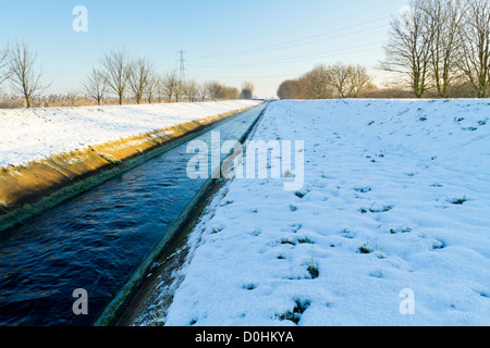 Treated sewerage from a Severn Trent Water treatment plant in a channel to the River Trent in Winter. Stoke Bardolph, Nottinghamshire, England, UK Stock Photo