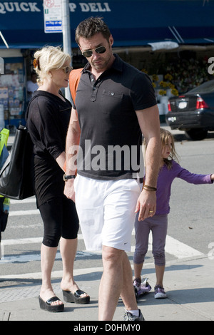 Hugh Jackman and Deborra-Lee Furness walking home with their daughter Ava after collecting her from school New York City, USA - Stock Photo