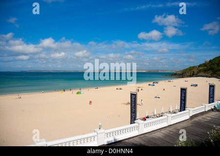 A view of the harbour beach at St Ives with the tide in on a sunny spring day. Stock Photo
