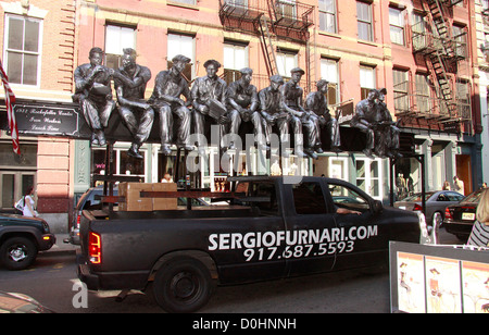 A 2001 sculpture of 'The 1932 Rockefeller Center Iron Workers Lunch Time' by world-known master artisan Sergio Funari, spotted Stock Photo