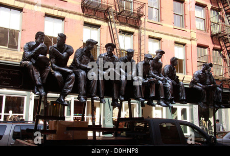 A 2001 sculpture of 'The 1932 Rockefeller Center Iron Workers at Lunch Time' by world-known master artisan Sergio Funari, Stock Photo