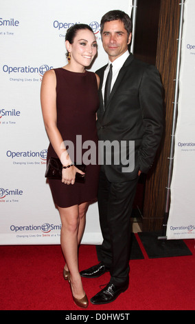 John Stamos and Guest Operation Smile's 2010 Smile Gala held at The Beverly Hilton Hotel Beverly Hills, California - 24.09.10 Stock Photo