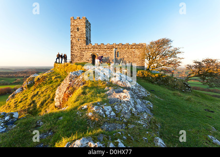 A view of St Michael's Church on top of Brent Tor at sunset. Stock Photo