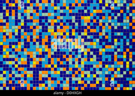 Multicolored mosaic tile wall in blue, orange, yellow and green Stock Photo