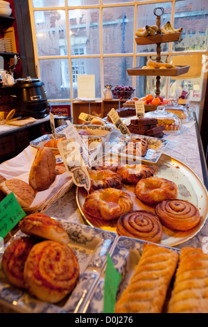 Traditional English cakes and savouries on display in the Apothecary cafe in Rye. Stock Photo