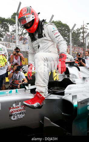 25.11.2012. Sao Paulo, Brazil.  Motorsports: FIA Formula One World Championship 2012, Grand Prix of Brazil, #7 Michael Schumacher (GER, Mercedes AMG Petronas F1 Team)exits his car for his land grand prix before retirement Stock Photo