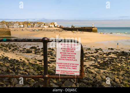 Dogs sign on beach Stock Photo