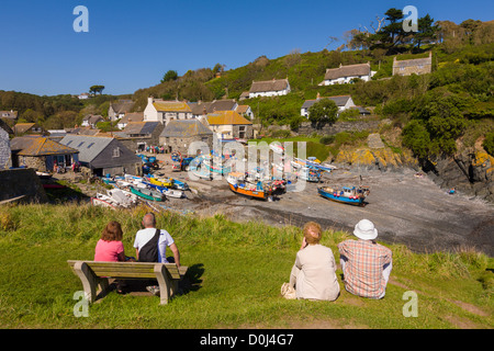 Tourists looking at Cadgwith harbour, Cornwall, England Stock Photo