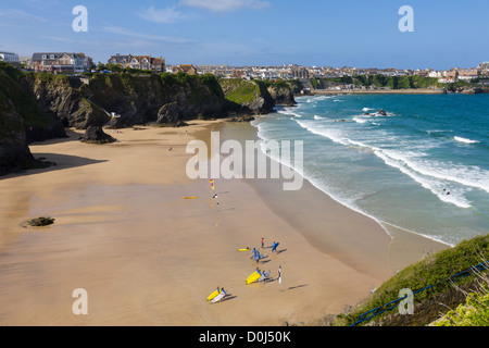Surfers on beach at Great Western beach, Newquay, Cornwall, England Stock Photo