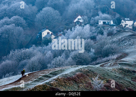 Two young women with their dogs jogging in the Malvern Hills. Stock Photo