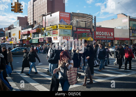 Shoppers in the busy Flushing neighborhood of Queens in New York Stock Photo