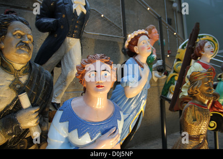 In the dry berth under Cutty Sark is the largest collection of merchant navy figureheads in the world. Stock Photo
