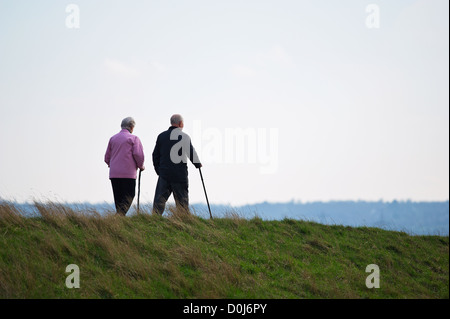 A couple walking along a track. Stock Photo