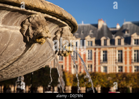 Lion Heads fountain details in Place des Vosges, les Marais, Paris France Stock Photo