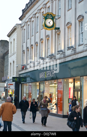Shoppers passing by a Marks & Spencer department store in Cheltenham. Stock Photo