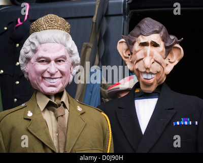 Famous faces at a stall selling masks and hats at Portobello Road market. Stock Photo