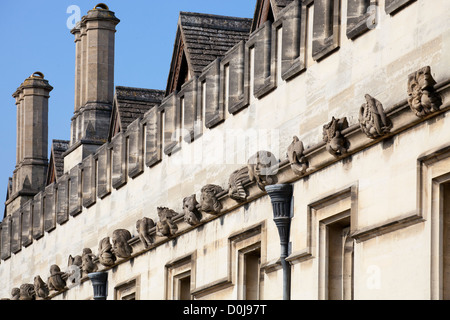 An array of gargoyles and exotics adorning the walls of Magdalen College in Oxford. Stock Photo
