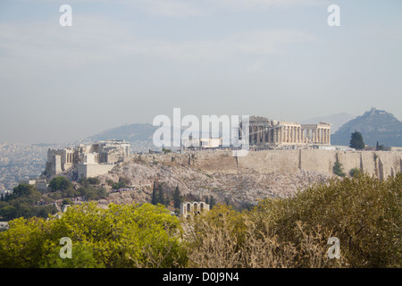 The Acropolis of Athens is an ancient citadel located on a high rocky outcrop above the city of Athens and containing the remains of several ancient buildings of great architectural and historic significance, the most famous being the Parthenon. Stock Photo