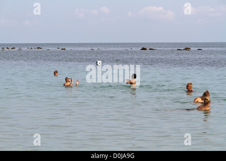 Tourists in the Ocean at Chaweng Beach on Ko Samui, Thailand Stock Photo