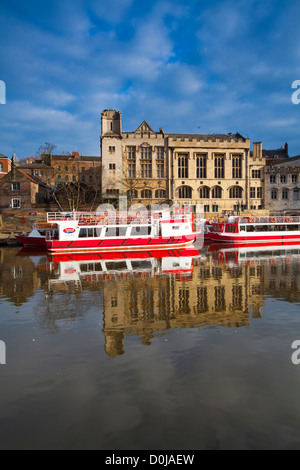 York city river cruise boats moored on the River Ouse with the Guildhall in the background. Stock Photo