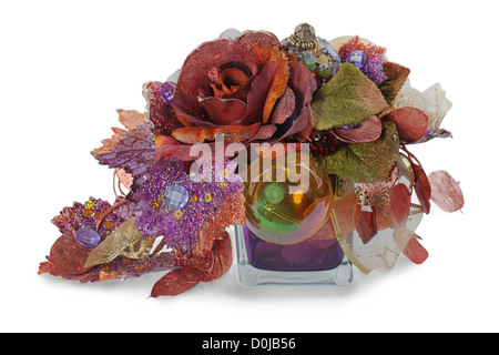 Christmas arrangement of Christmas balls, artificial flowers, beads and pine branches in vase isolated on white background Stock Photo